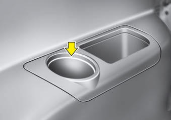 Cups or small beverage cans may be placed in the cup holders.