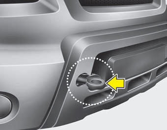 3. Install the towing hook by turning it