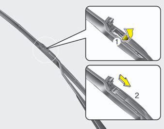 2. Lift up the wiper blade clip. Then pull